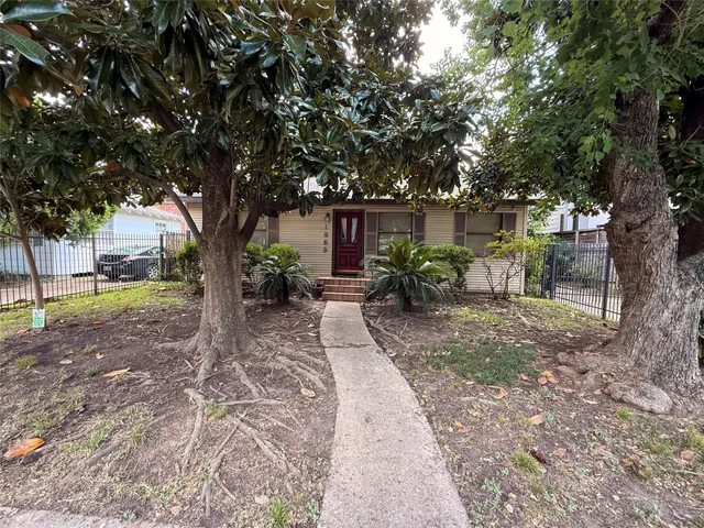 a view of backyard with outdoor seating and tree