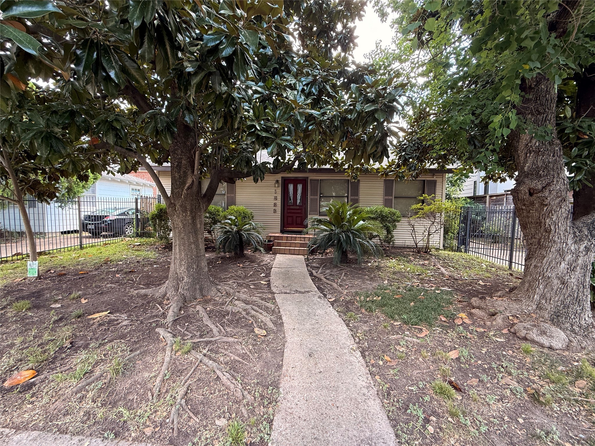 a view of backyard with outdoor seating and tree