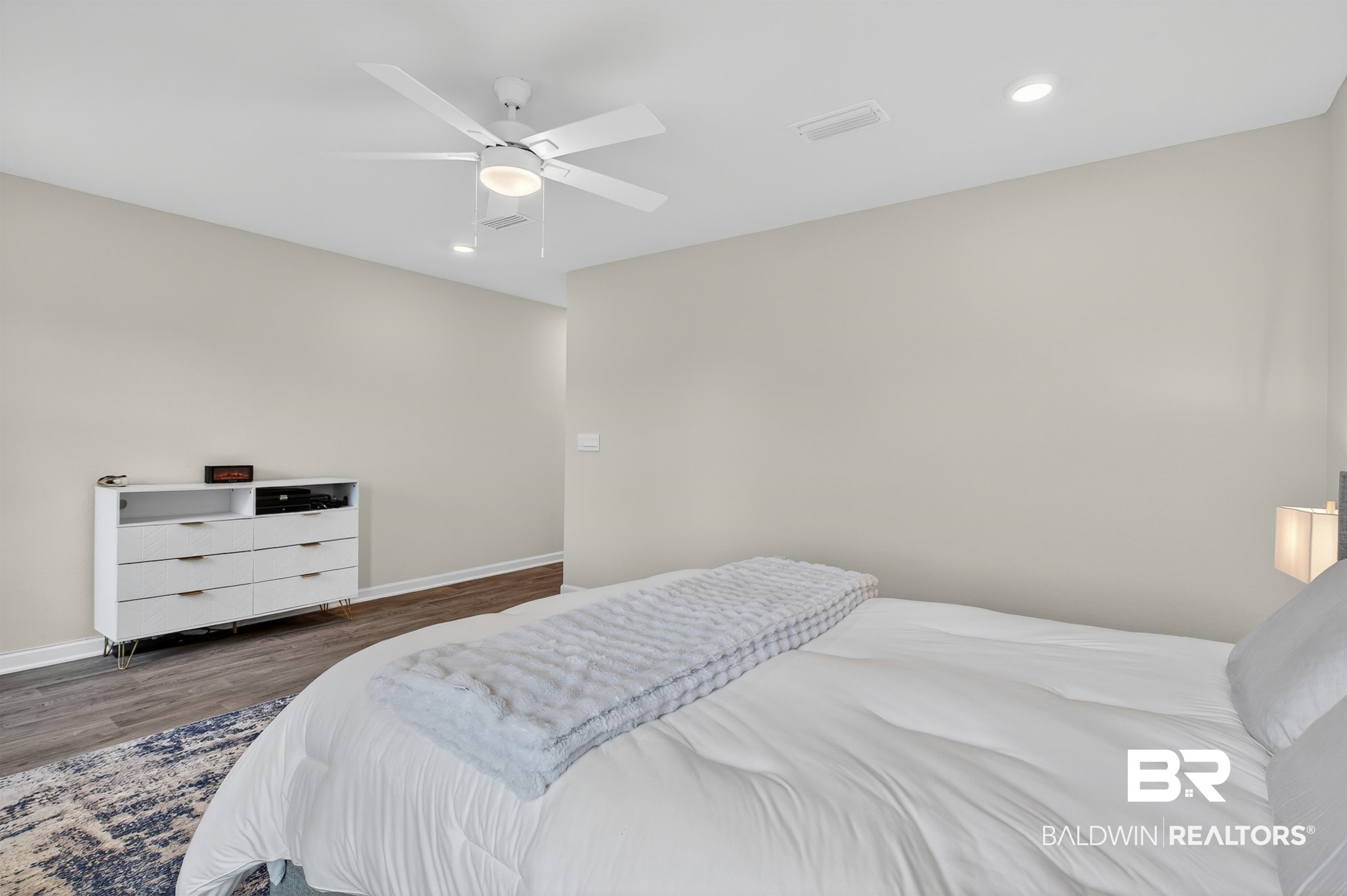 3213 Camino Real Loop Lillian, AL 36549 - Photo 39 of 61 Spacious bedroom featuring light-toned walls, wood-finish flooring, and recessed ceiling lighting
