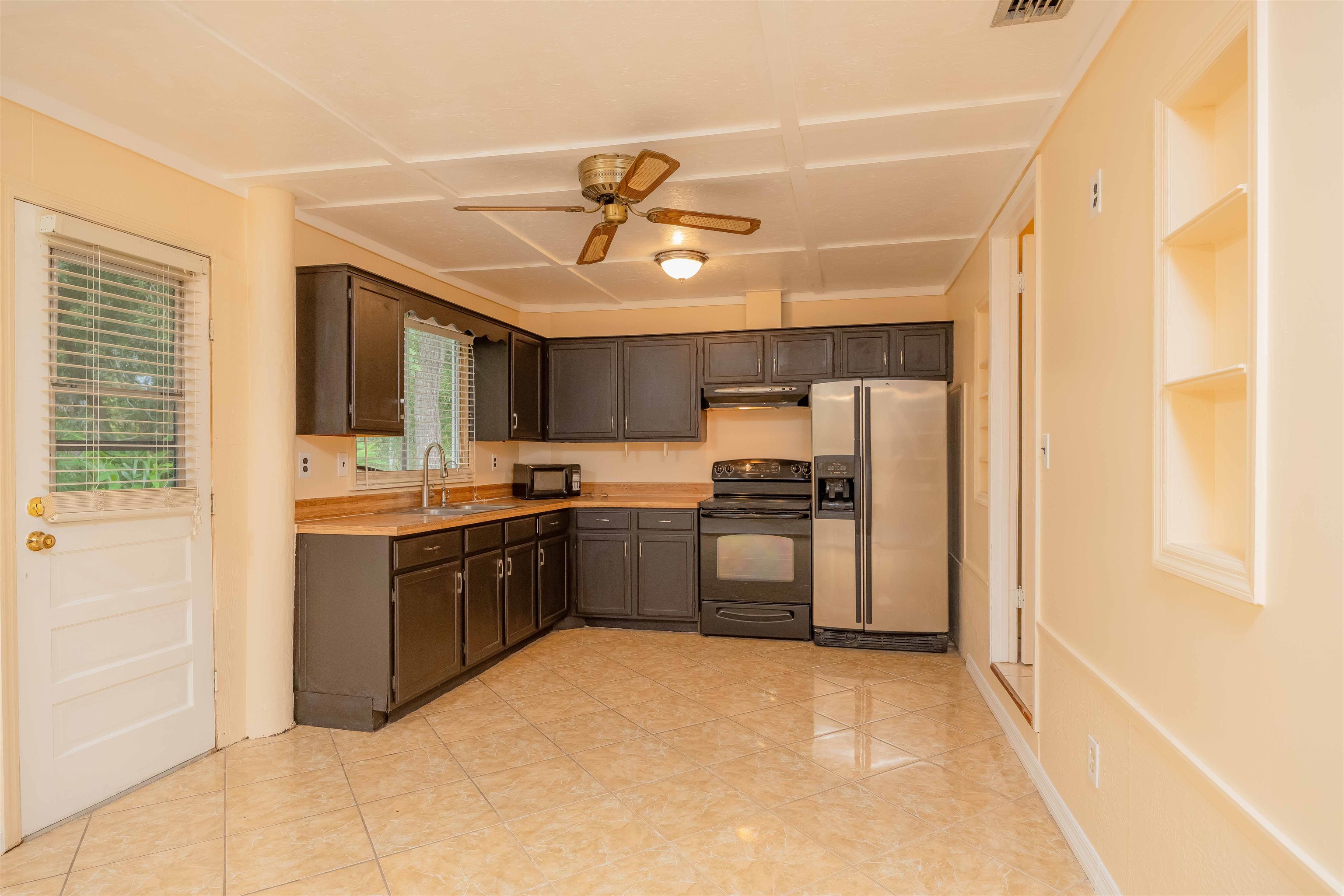 7557 Highway 1 St. Augustine, FL 32086 - Photo 15 of 60 a large kitchen with a large counter top space appliances and cabinets