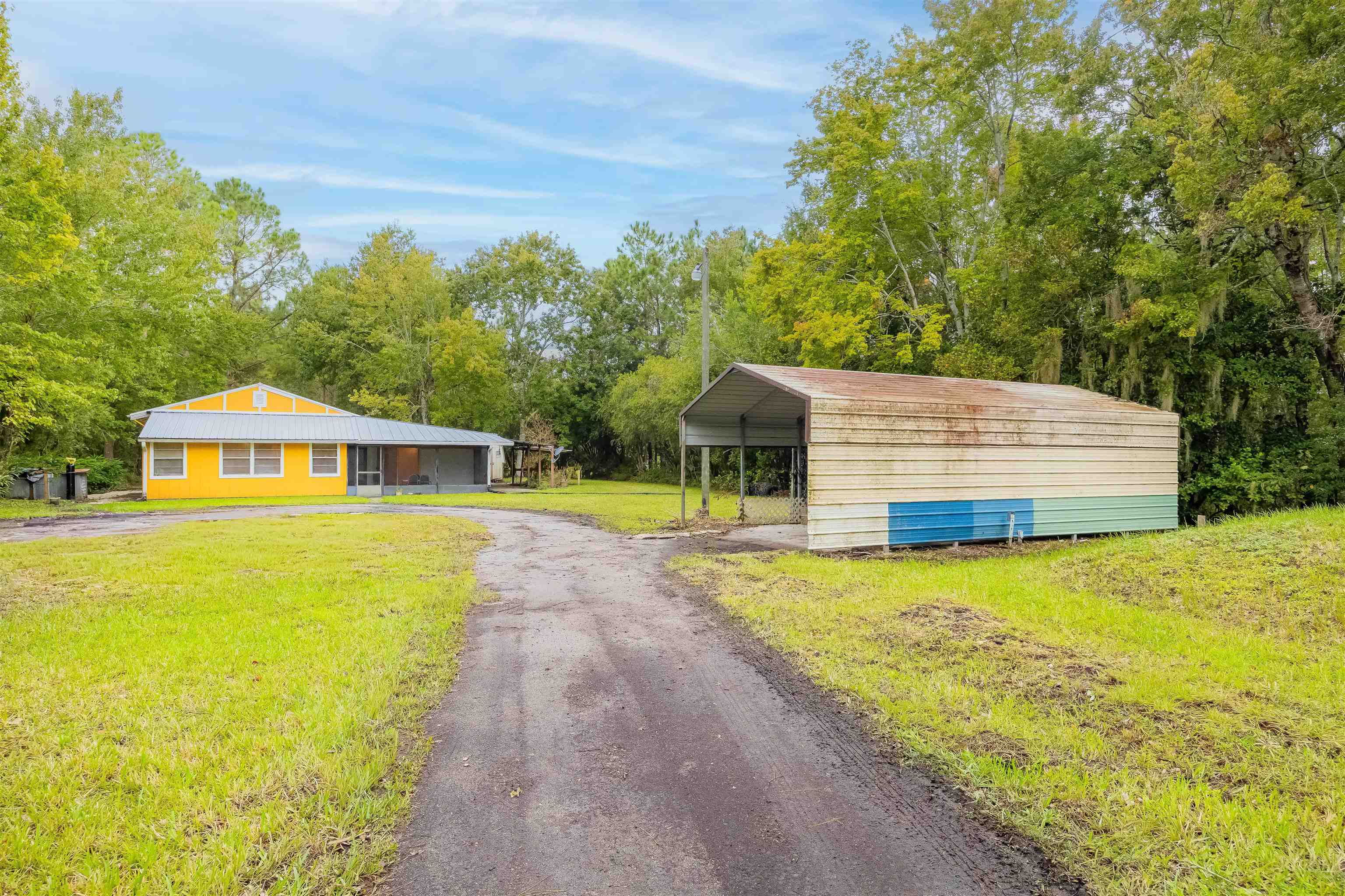 7557 Highway 1 St. Augustine, FL 32086 - Photo 30 of 60 a front view of a house with a yard