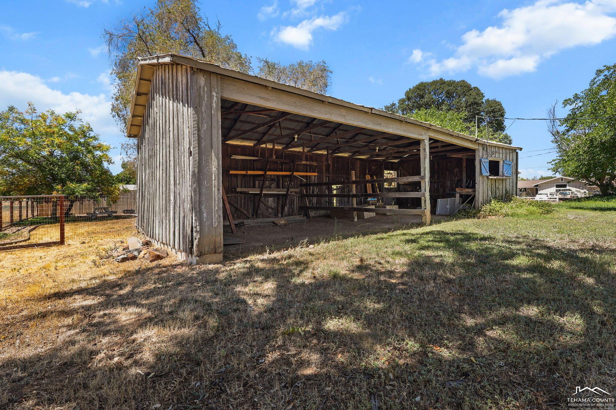 22275 Brent Road Red Bluff, CA 96080 - Photo 36 of 47 a view of a house with a yard and garage
