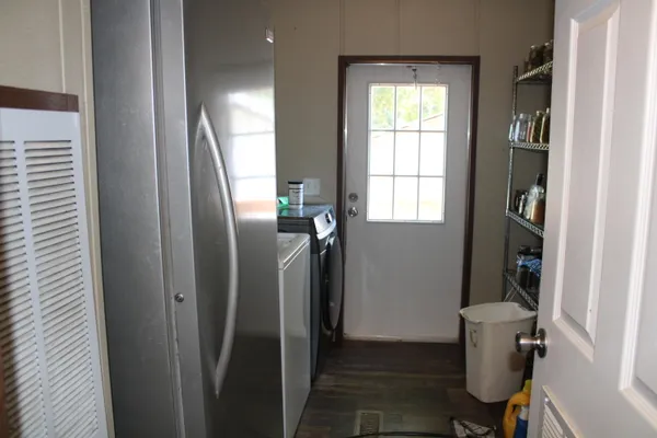 a view of a hallway with furniture and closet