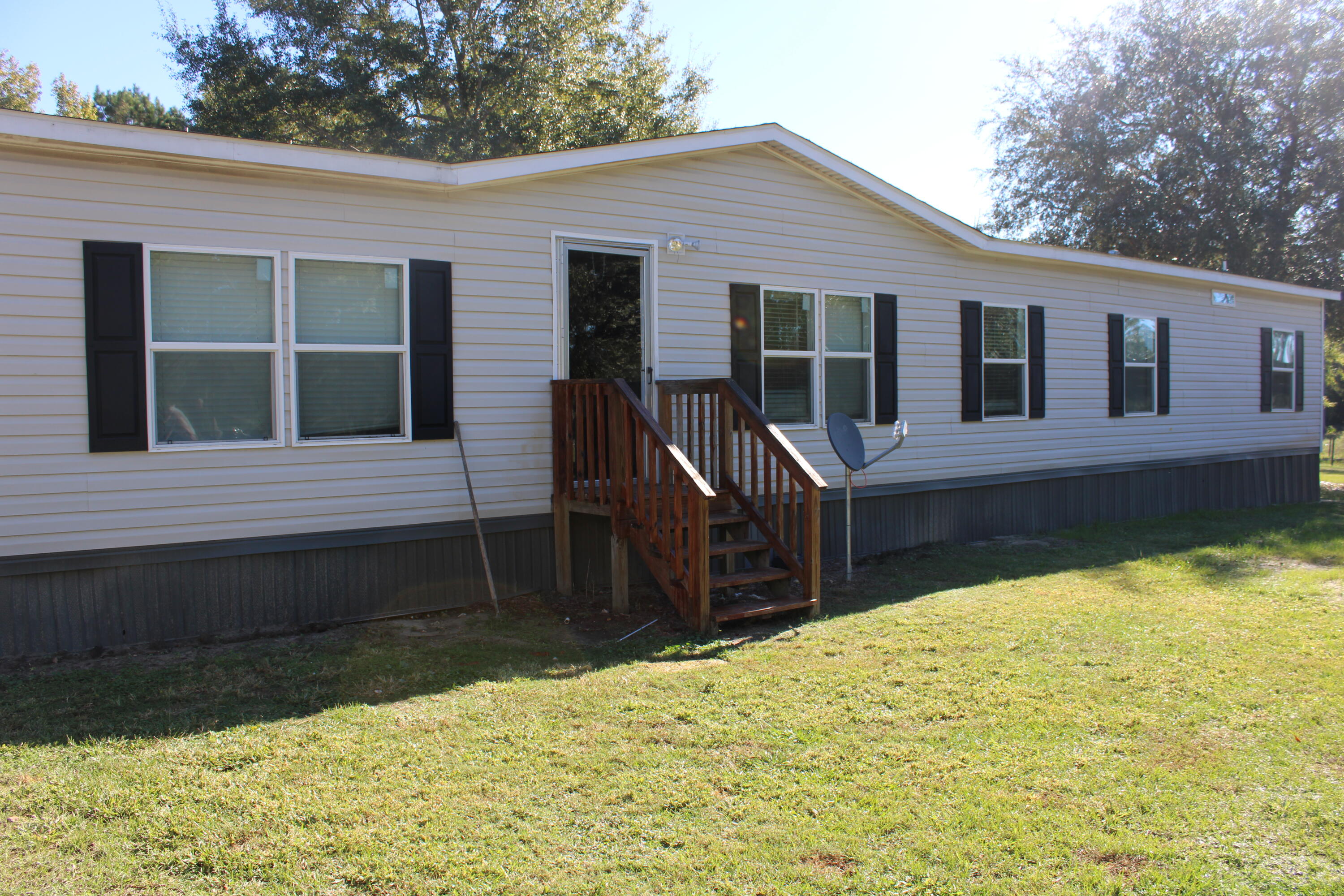 3260 Highway 55 Florala, AL 36442 - Photo 2 of 21 a front view of a house with a yard