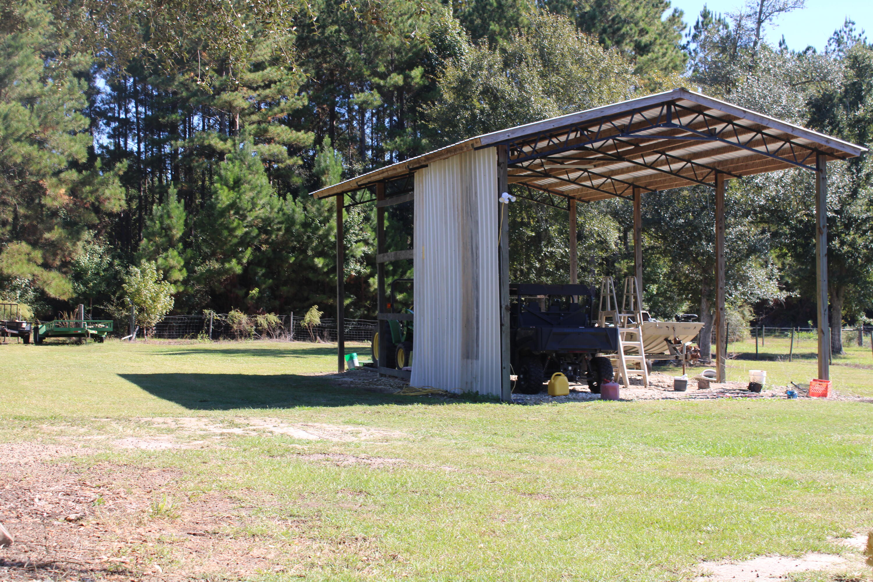 3260 Highway 55 Florala, AL 36442 - Photo 21 of 21 a view of a patio with a table chairs and a small yard