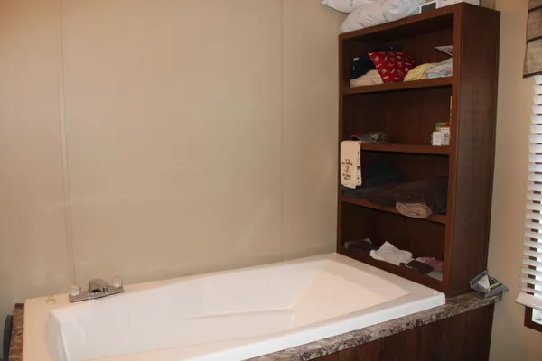 a bathroom with a bathtub and toilet