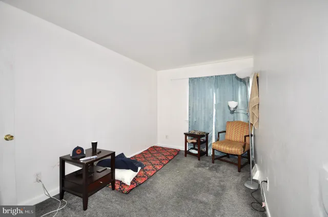 a living room with furniture and a chair