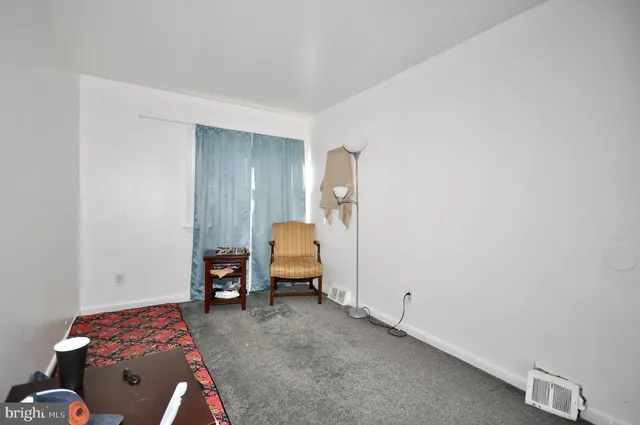 a bedroom with a bed and gym equipment