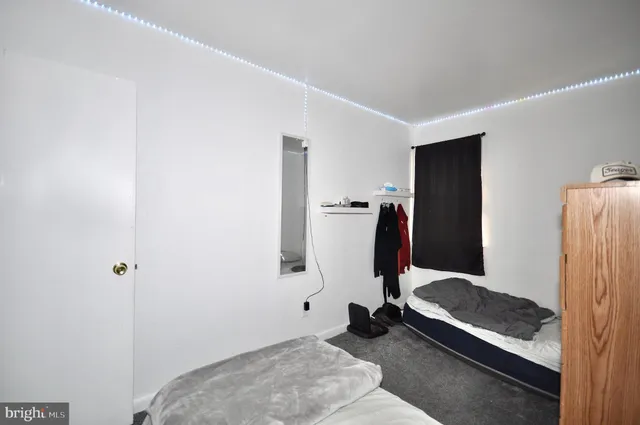 a view of a bedroom with gym equipment