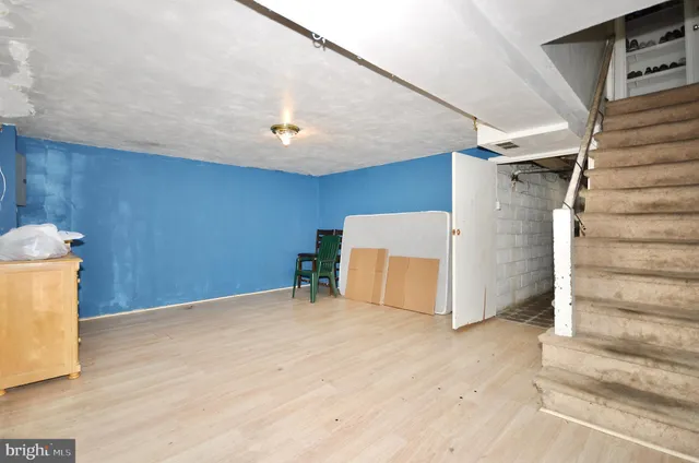 a view of a room with wooden walls