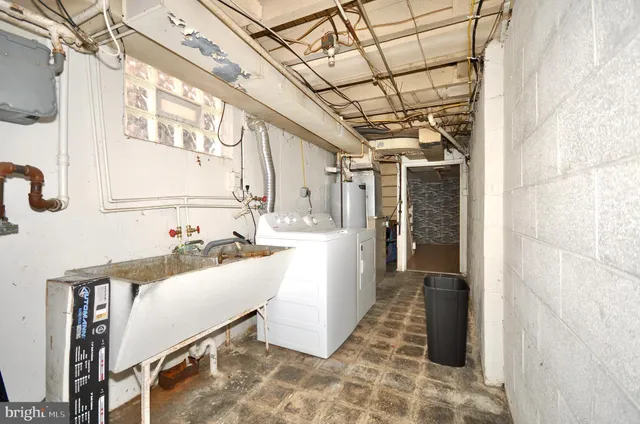 a bathroom with a sink mirror and shower