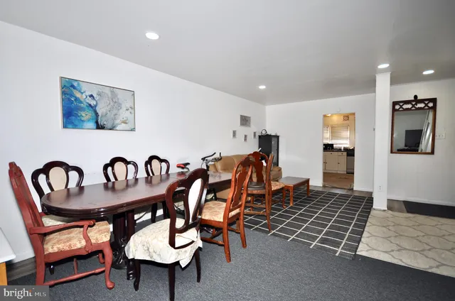 a dining room with furniture and window