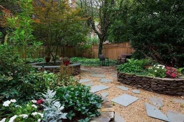 a backyard of a house with lots of green space and trees all around