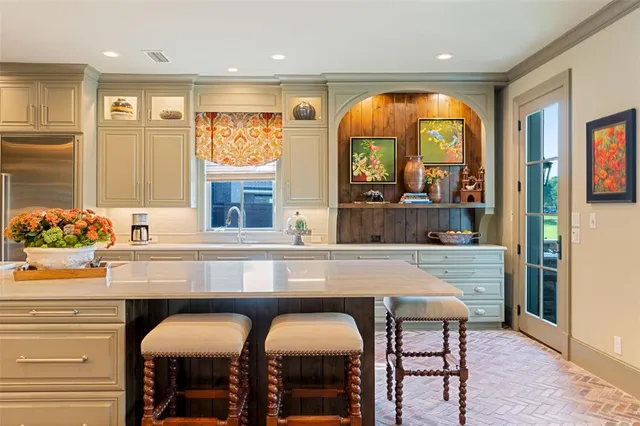 a dining table with chairs and window