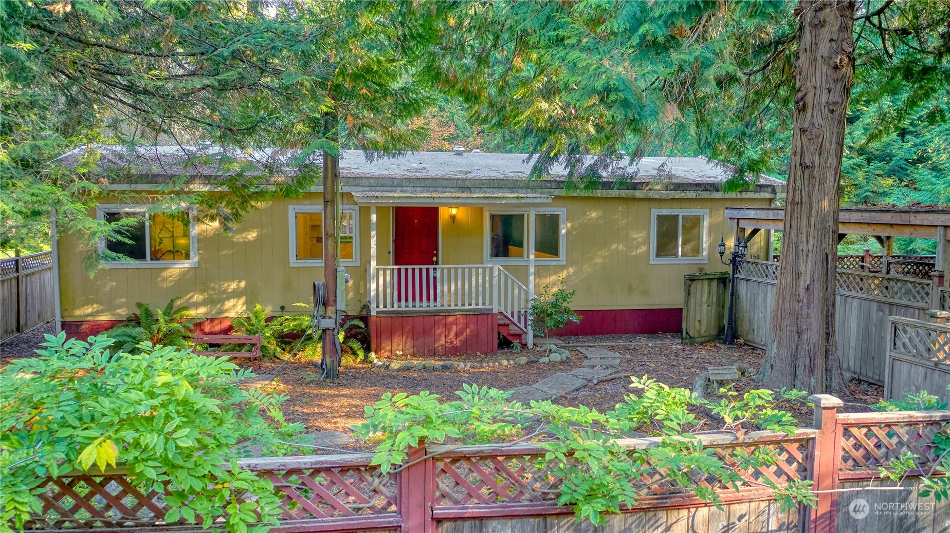 156 Mill Road Point Roberts, WA 98281 - Photo 2 of 27 front view of a house with a yard
