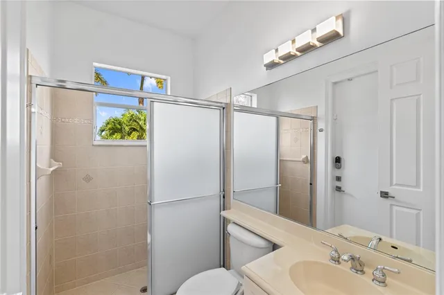 a kitchen with stainless steel appliances granite countertop a sink and a stove