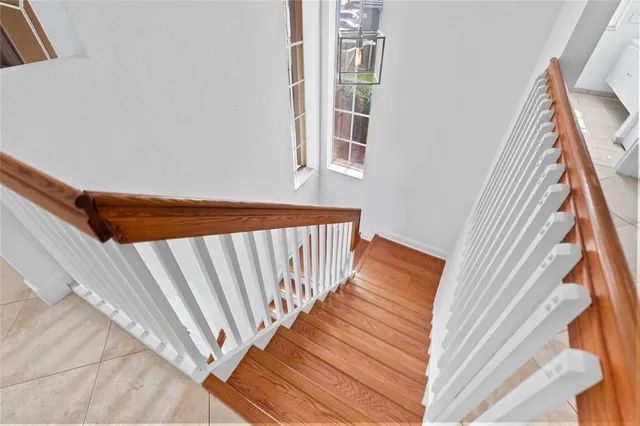 a bathroom with a tub a sink double vanity and mirror