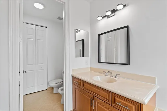 a bathroom with a double vanity sink a mirror and a shower