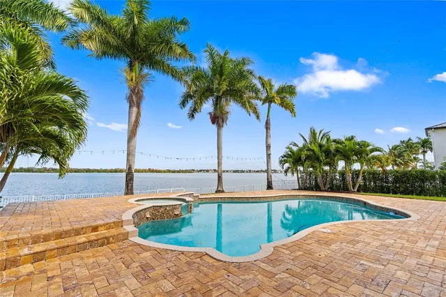 a view of a swimming pool and an outdoor space