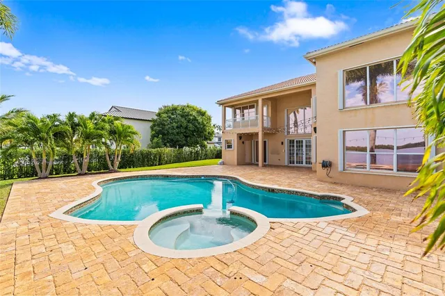 a swimming pool with view od palm trees