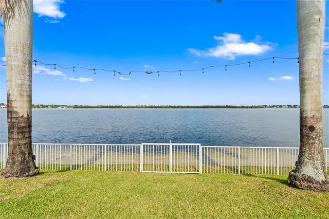 a view of a swimming pool with an outdoor seating and yard
