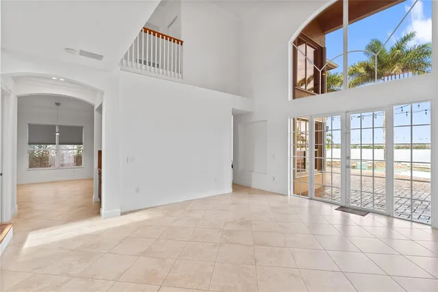 a large kitchen with stainless steel appliances granite countertop a stove and a sink
