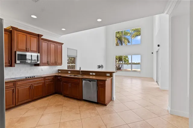 a kitchen with stainless steel appliances granite countertop a sink and a cabinets