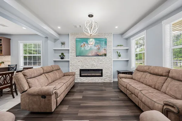 a kitchen with a sink a counter top space stainless steel appliances and cabinets