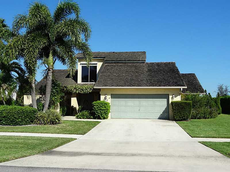 22338 Ensenada Way Boca Raton, FL 33433 - Photo 1 of 20 a front view of a house with a yard