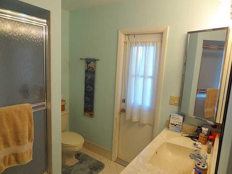 22338 Ensenada Way Boca Raton, FL 33433 - Photo 11 of 20 a bathroom with a sink toilet and shower