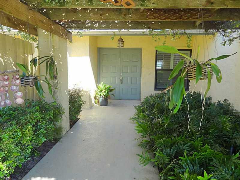22338 Ensenada Way Boca Raton, FL 33433 - Photo 2 of 20 a view of a entryway door of the building and front door