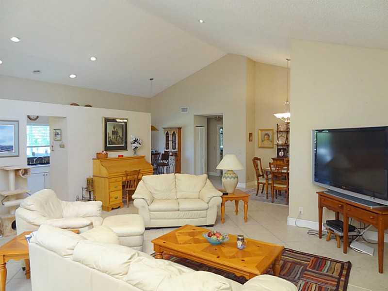 22338 Ensenada Way Boca Raton, FL 33433 - Photo 3 of 20 a living room with furniture and a flat screen tv