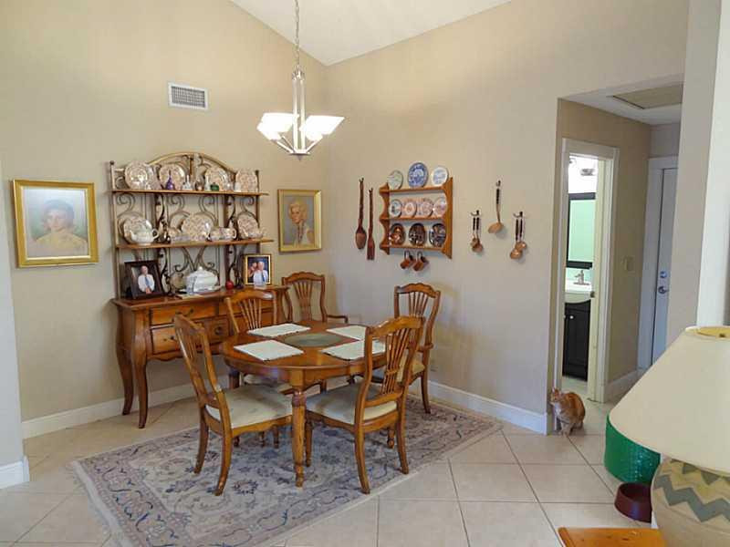 22338 Ensenada Way Boca Raton, FL 33433 - Photo 6 of 20 a view of a dining room with furniture