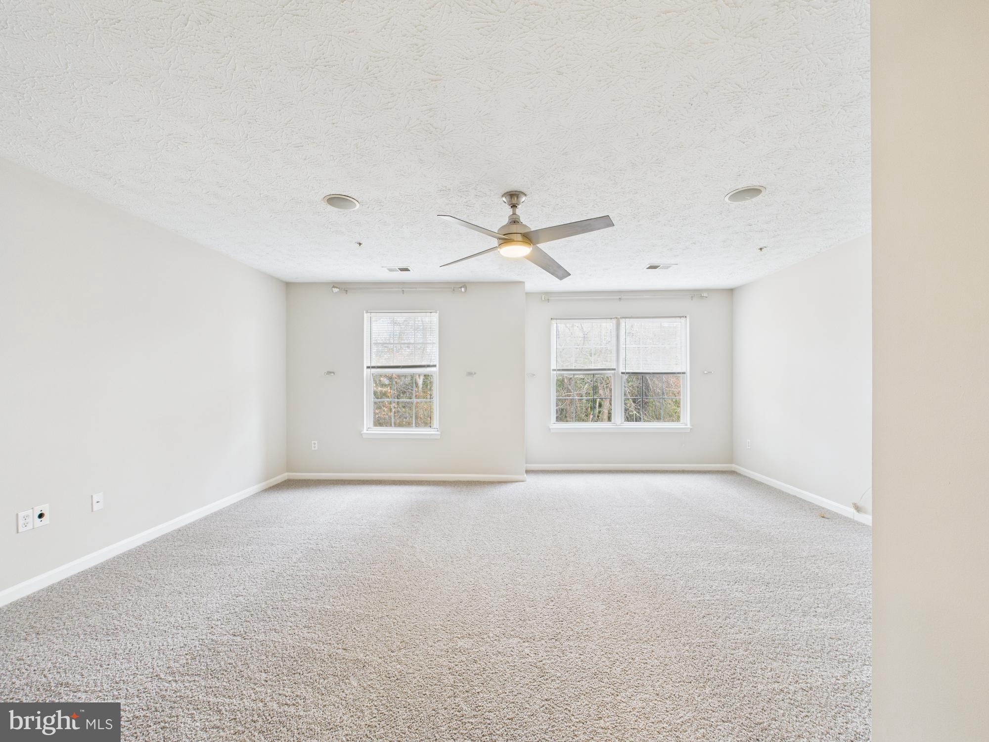 8067 Brookstone Court, Unit 100 Severn, MD 21144 - Photo 29 of 36 a view of an empty room with a window