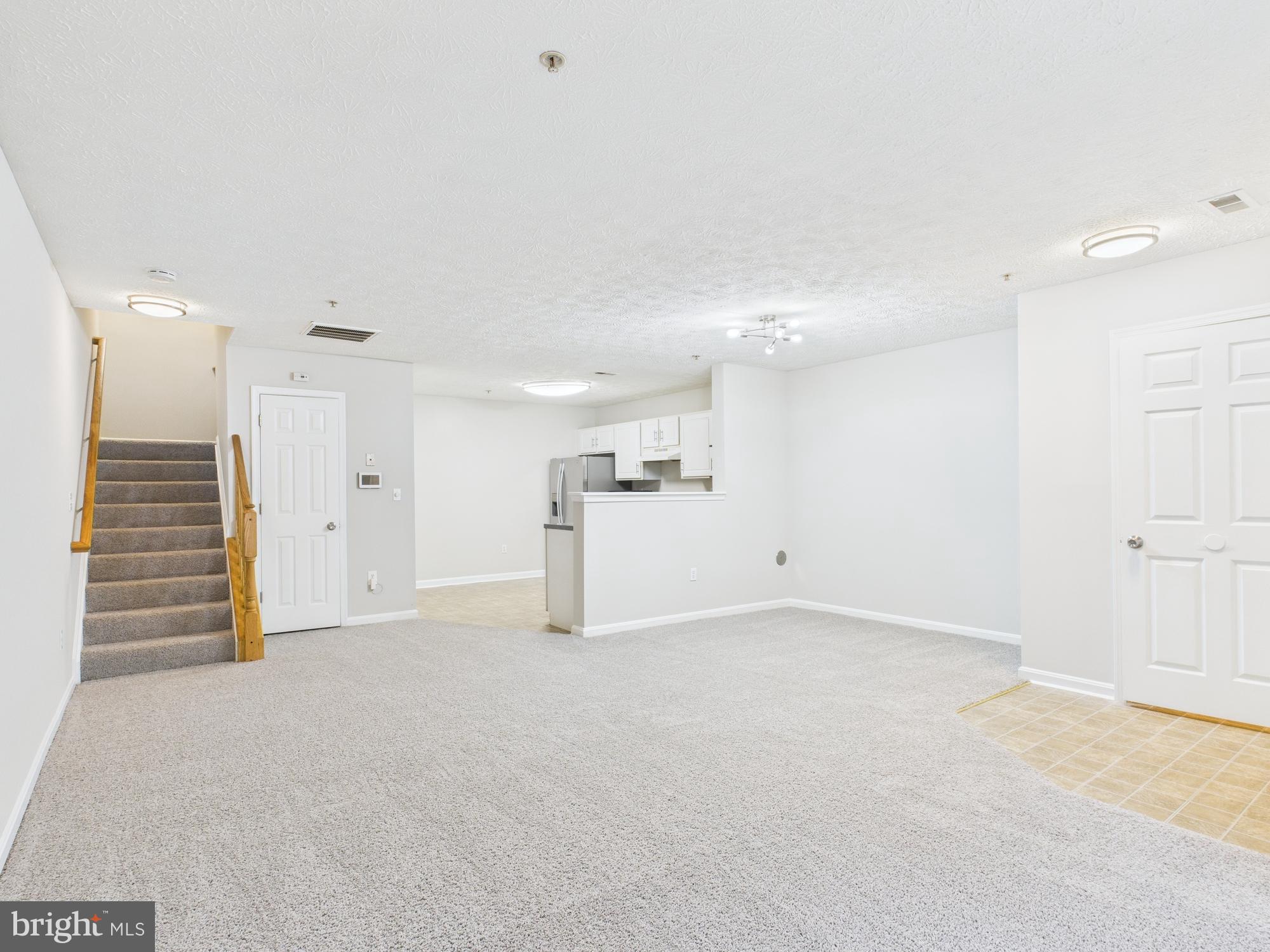 8067 Brookstone Court, Unit 100 Severn, MD 21144 - Photo 3 of 36 a view of an empty room