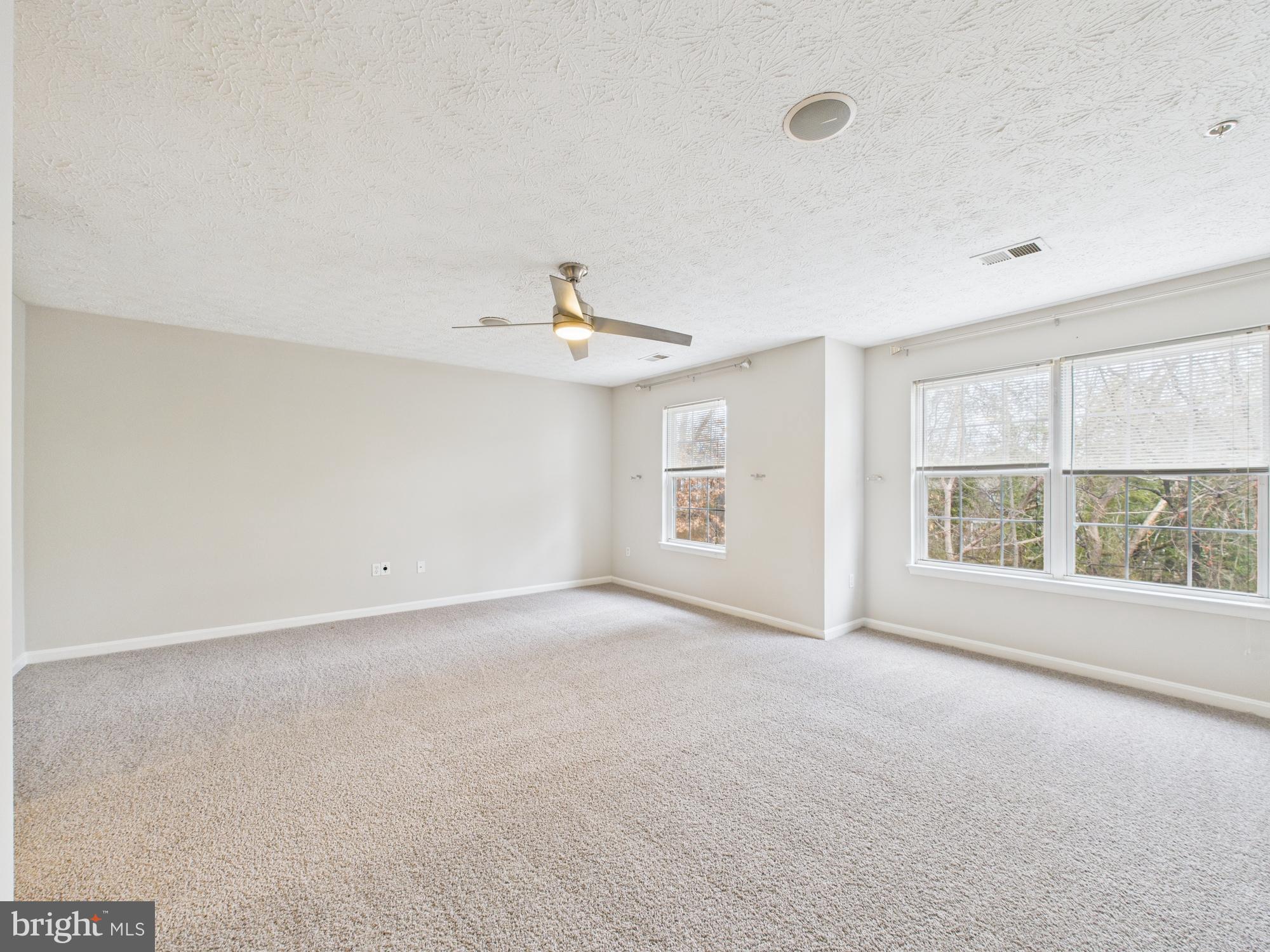 8067 Brookstone Court, Unit 100 Severn, MD 21144 - Photo 33 of 36 a view of an empty room with a window
