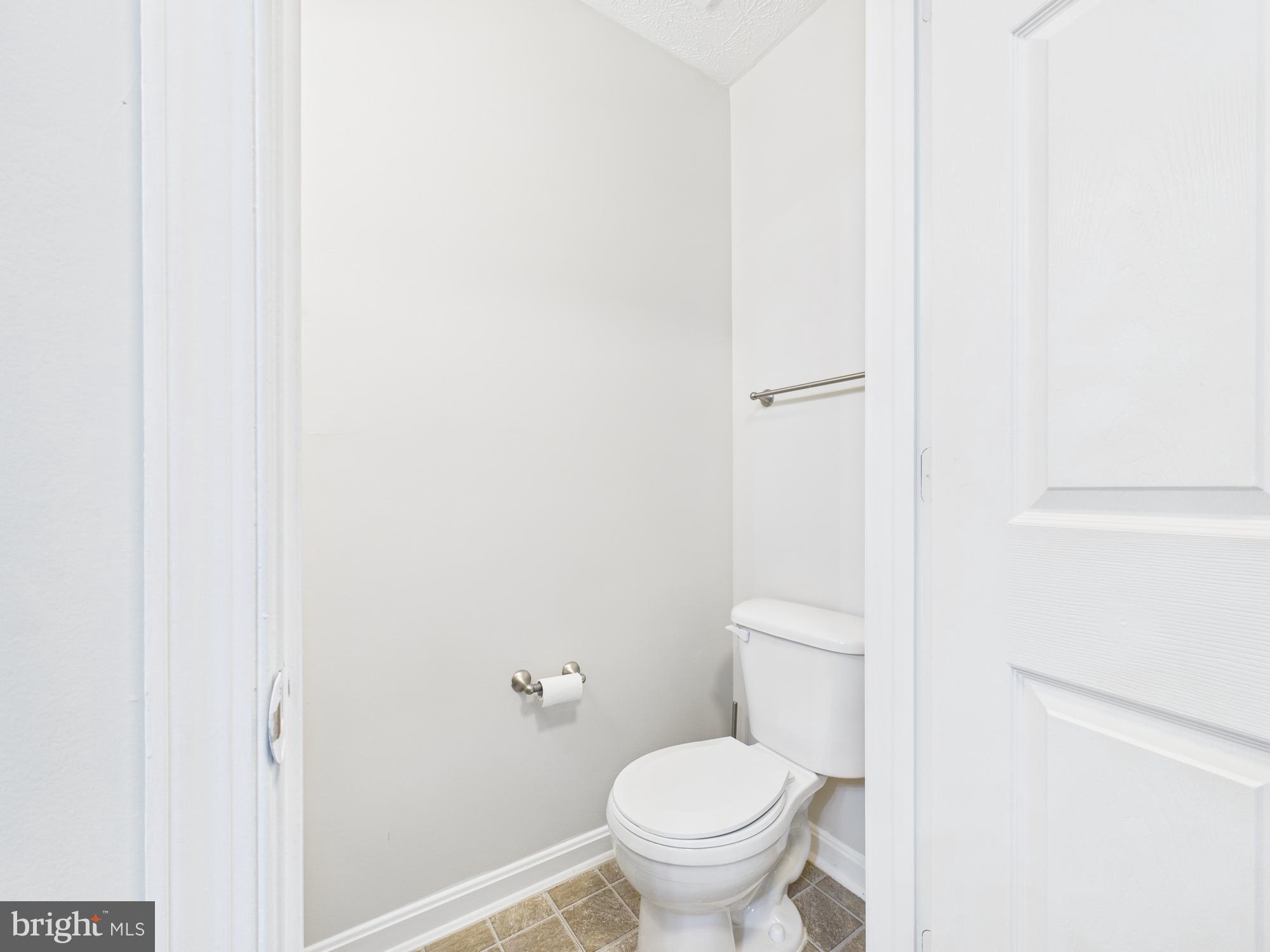 8067 Brookstone Court, Unit 100 Severn, MD 21144 - Photo 10 of 36 a bathroom with a toilet