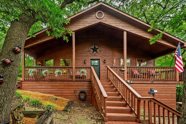 a view of a wooden deck with a yard