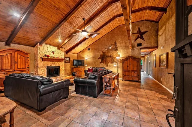 a kitchen with stainless steel appliances kitchen island granite countertop a stove and cabinets