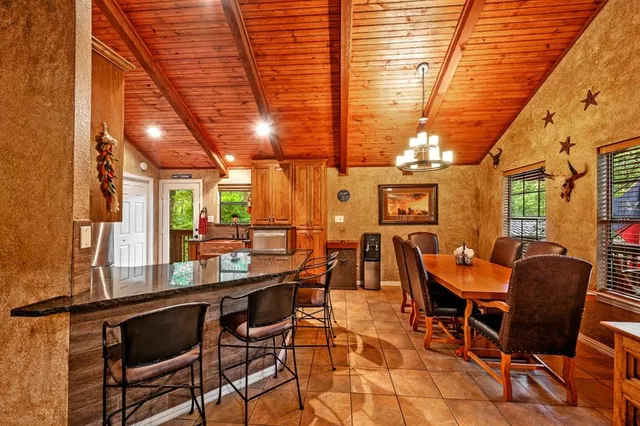a living room with furniture a rug and a large window