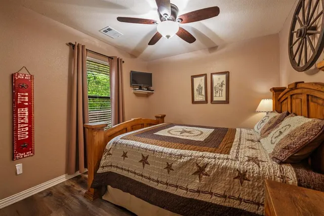 a view of a balcony with chairs and wooden floor