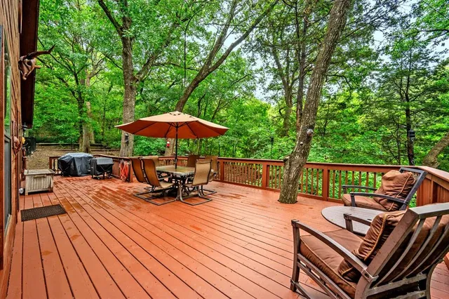 a view of roof deck with patio