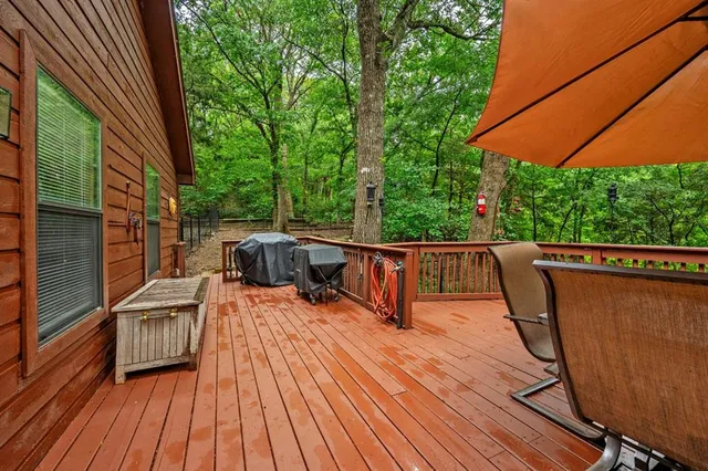 a view of deck with wooden floor and outdoor seating