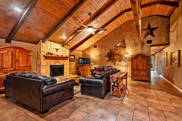 a view of a patio with table and chairs