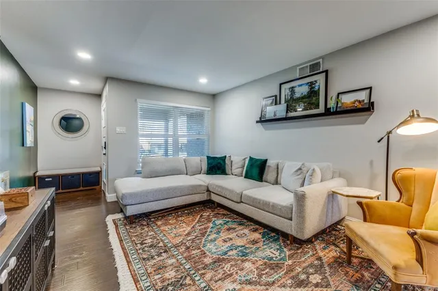 a living room with furniture and a rug