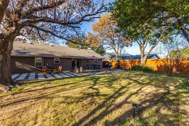 a view of a house with swimming pool and sitting area