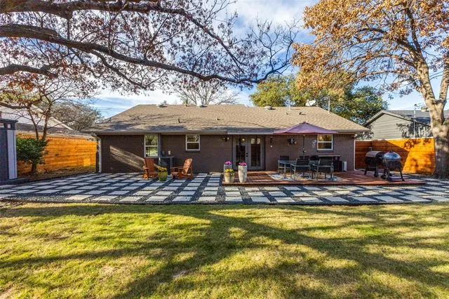 a view of a house with pool and sitting area