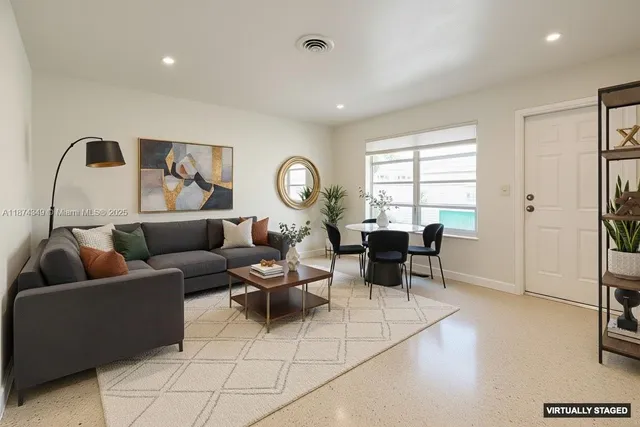 a living room with furniture and a window