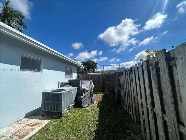 a view of backyard with furniture