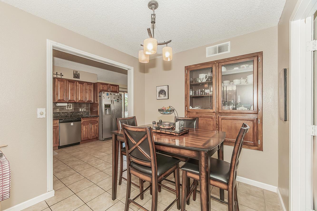 1908 East Niles Avenue Fresno, CA 93720 - Photo 6 of 30 a view of a dining room with furniture and window